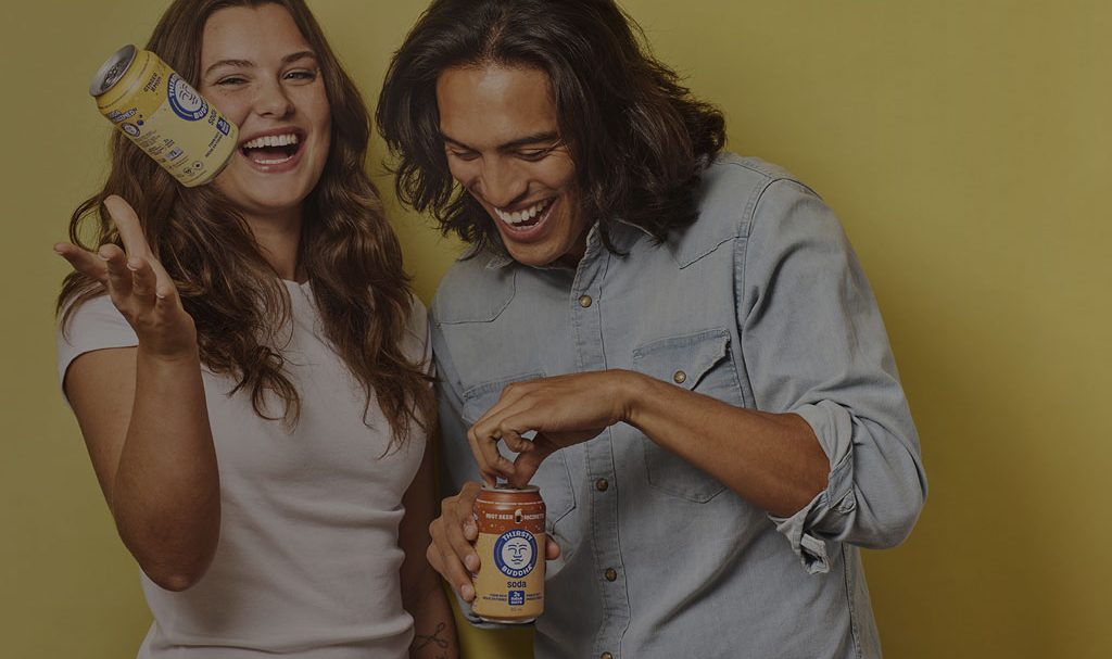 Buddha_brands_background A background image for Buddha Brands of two friends laughing with cans of drink